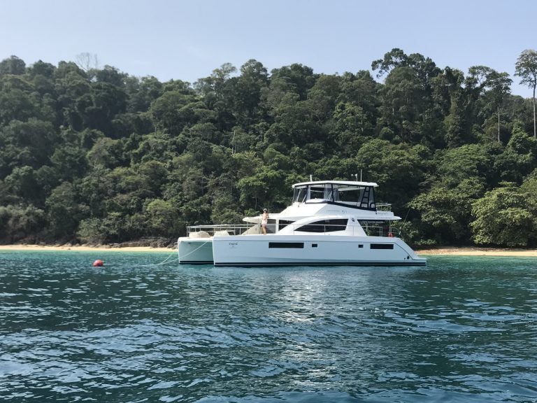 YATI Leopard 51 luxury power catamaran anchored at a Phuket island on a boat charter in Thailand