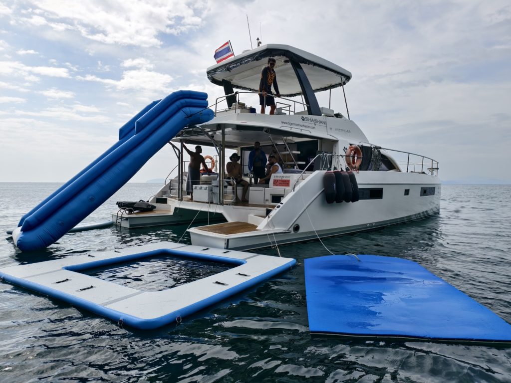 Guests on the SHASH power catamaran with floating jacuzzi in Phuket
