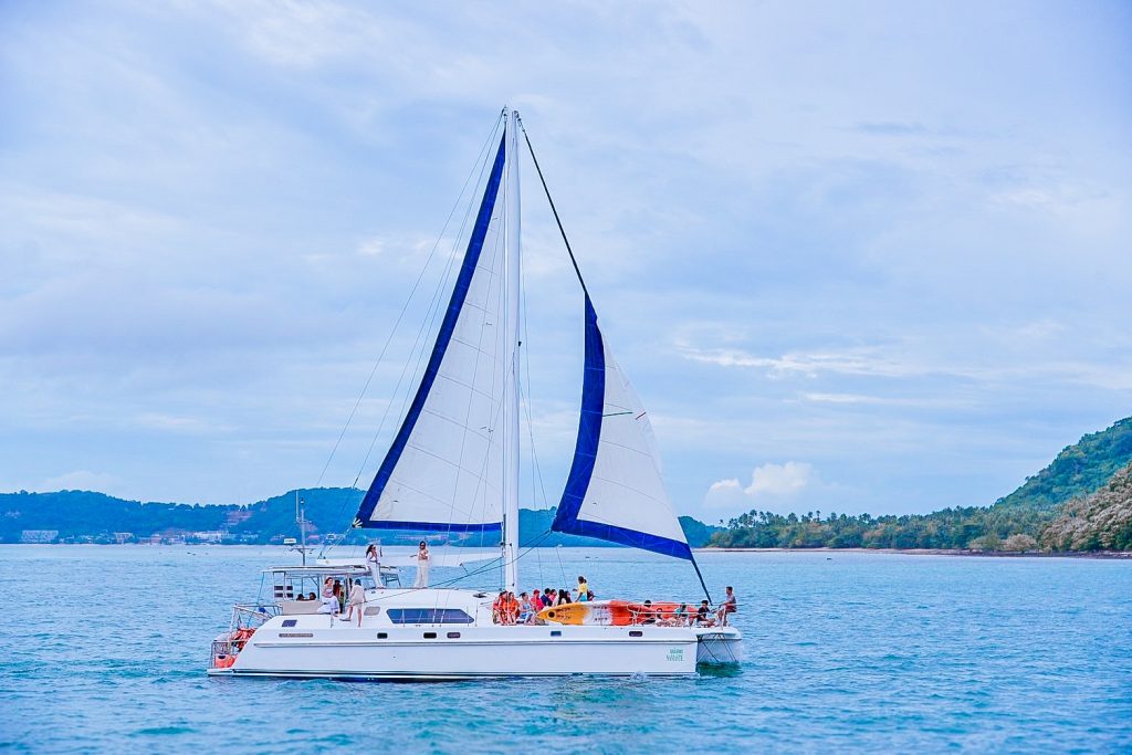 Guests aboard the ASTE catamaran during a Phuket island cruise