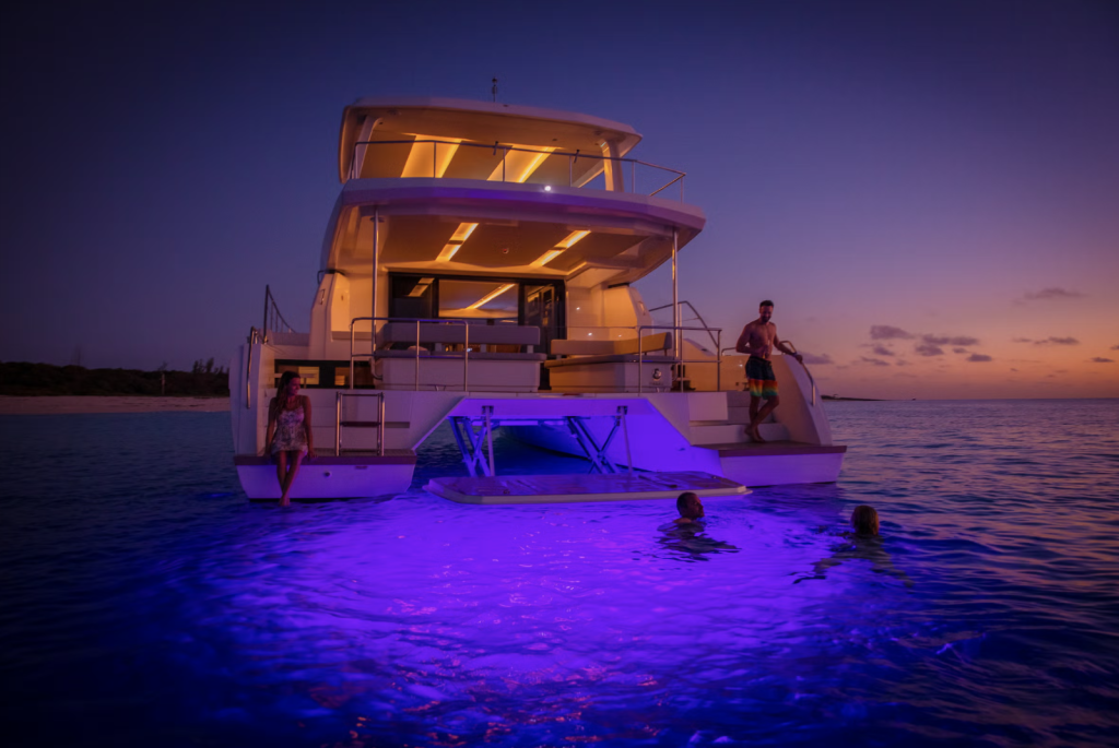 Guests on the flybridge of the ZIM power catamaran cruising Phuket