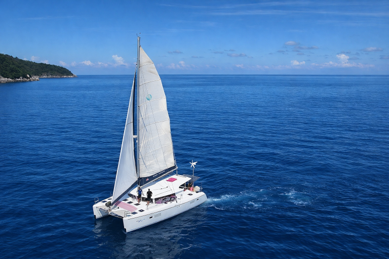PEACHES Lagoon 421 luxury catamaran under sail on a boat charter in Phuket, Thailand