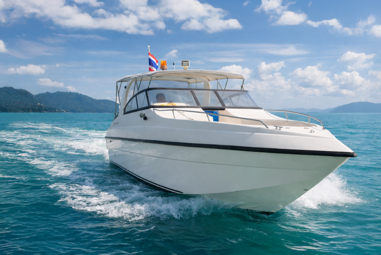 Thai speedboat cruising at speed on a charter from Phuket, Thailand