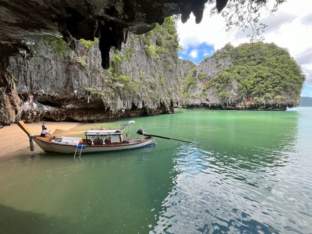 The Executive boat in the standing at the limestone caves in Phang Nga bay